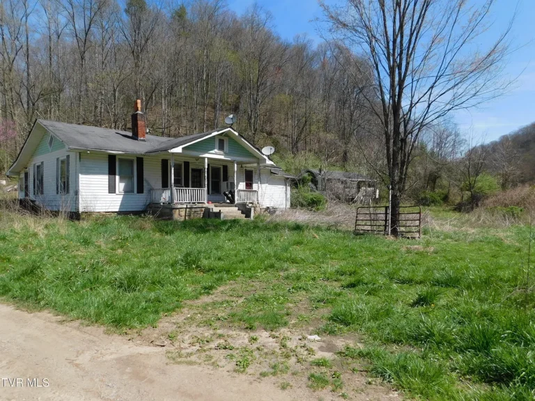 Multi-Home Riverfront Property with Gardens, Outbuildings & Endless Potential
