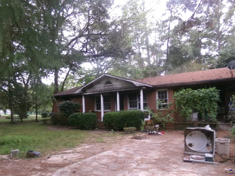 3-Bedroom Ranch on 1.4+ Acres with Basement and Multiple Porches – Great Potential