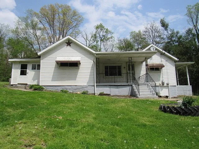 3-Bedroom Ranch on 1.4+ Acres with Basement and Multiple Porches – Great Potential